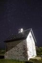 Vertical shot of a small house in Cape Cod, USA at night