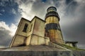 Cape Disappointment Lighthouse under dramatic skies Royalty Free Stock Photo