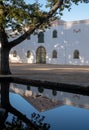 Cape Dutch style farm building at Groot Constantia, Cape Town, South Africa, reflected in a pond in the early morning. Royalty Free Stock Photo