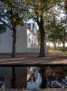 Cape Dutch style farm building at Groot Constantia, Cape Town, South Africa, reflected in a pond in the early morning. Royalty Free Stock Photo