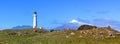 Cape Egmont lighthouse and Mount Taranaki panoramic view, New Zealand Royalty Free Stock Photo