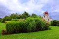 The Cape Egmont Lighthouse is a three-storey square tapered tower