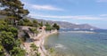 The cape Ferrat, embankment on the azure coast, mountains and the blue sky on background, megayachts of Billionaires