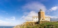 Cape Finisterre Lighthouse in warm morning light Royalty Free Stock Photo