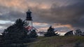 Cape Flattery Lighthouse surrounded by buildings and green trees in Washington, USA Royalty Free Stock Photo