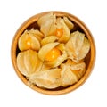 Cape gooseberries with partly open calyx, in a wooden bowl Royalty Free Stock Photo