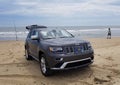 Cape Henlopen Beach, Delaware, U.S - May 16, 2022 - A Jeep Cherokee parked on the beach overlooking the ocean