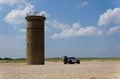 Cape Henlopen, Delaware, U.S.A - August 25, 2023 - A Jeep Wrangler drove and passed the World War II tower on the beach