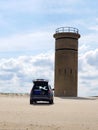 Cape Henlopen, Delaware, U.S - May 25, 2022 - A Jeep Grand Cherokee parked near the World War II tower on the beach