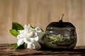 Cape jasmine or Gardenia jasminoides flowers and tea on an old wood background Royalty Free Stock Photo