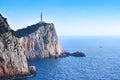 Cape Lefkada Lighthouse with steep cliffs and blue sea