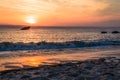 Cape May NJ lighthouse at sunset in early spring Atlantic Ocean with warm soft light