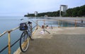 Cape Pitsunda embankment with an old bicycle and a fisherman\'s fishing rod on the seashore in Abkhazia in winter