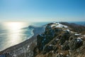 Cape Povorotny. Snow-covered coast. Royalty Free Stock Photo