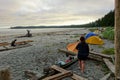 Campers making breakfast earlier at their campsites along the beach at Nels Bight, in Cape Scott Provincial Park, Canada.