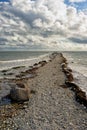 Cape of stones goes to the horizon of the sea