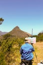 Cape Town - 2011: An artist painting Table Mountain