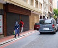 Cloudy day in Cape Town. Police woman walking with groceries