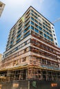 Construction workers on scaffolding on building site