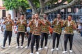 CAPE TOWN, SOUTH AFRICA - DECEMBER 23, 2017: group of young men in national african costumes dancing and singing presenting their