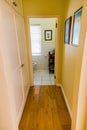 Inside interior of empty hallway with wooden floors in up-market house in the suburbs