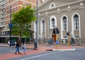 Two young women crossing the street in Cape Town.