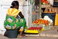 Cape Verdean woman sells vegetables at the market