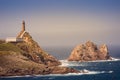 Cape Vilan lighthouse and VilÃ¡n de FÃ³ra islet, CamariÃ±as, Galicia, Spain Royalty Free Stock Photo