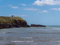 Cape of the Virgin Mary on a sunny day. The Irish coast, rock formation near body of water