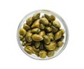 Capers in glass bowl isolated on white, top view Royalty Free Stock Photo