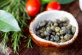 Capers and herbs. Selective focus Royalty Free Stock Photo