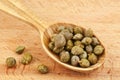 Capers in wooden spoon Royalty Free Stock Photo