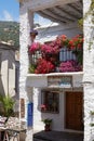 Capileira, Andalucia, Spain - May 29, 2019: Many flowers in flower pots on the street of Capileira Spain