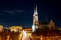 Capital of Austria Vienna at night, view on gothic church and streets of the city Royalty Free Stock Photo