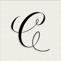 Capital C in copperplate style on textured paper.