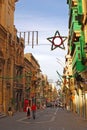 Typical street, Merchant St, Red British telephone box, Maltese architecture green window & Christmas decoration, Valletta, Malta