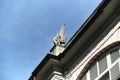 a capital depicting a train axle on the roof of a station Royalty Free Stock Photo