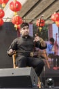 Young musician performing an erhu, a traditional Chinese musical instrument