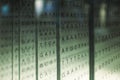 Capital letter code matrix written on different translucent glass boards in a row abstract scene with RNA and DNA codes