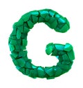 Capital letter G made of broken plastic green color isolated on white background