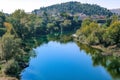 The capital of Montenegro Podgorica and a view of the Moraca river. Autumn nature, mountains, houses, cityscape. Royalty Free Stock Photo