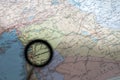 The capital of Syria, Damascus, through a magnifying glass on the background of a geographical map. Background Royalty Free Stock Photo