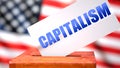 Capitalism and American elections, symbolized as ballot box with American flag  and a phrase Capitalism on a ballot to show that Royalty Free Stock Photo