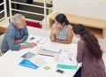 Capitalizing on their combined skill set. a team of colleagues having a meeting in a modern office. Royalty Free Stock Photo