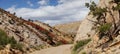 Capitol reef, central Utah, USA. Panoramic view from road to mountains and red clays with beautiful clouds in blue sky. Royalty Free Stock Photo