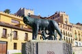 Capitoline Wolf statue under the Roman aqueduct in Segovia