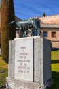 The Capitoline Wolf statue under the Roman aqueduct in Segovia