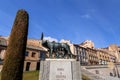 The Capitoline Wolf statue under the Roman aqueduct in Segovia