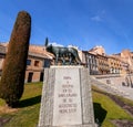 The Capitoline Wolf statue under the Roman aqueduct in Segovia