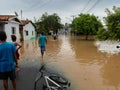 People crossing flooded streets - Capivari river overflow - Sao Paulo - Brazil